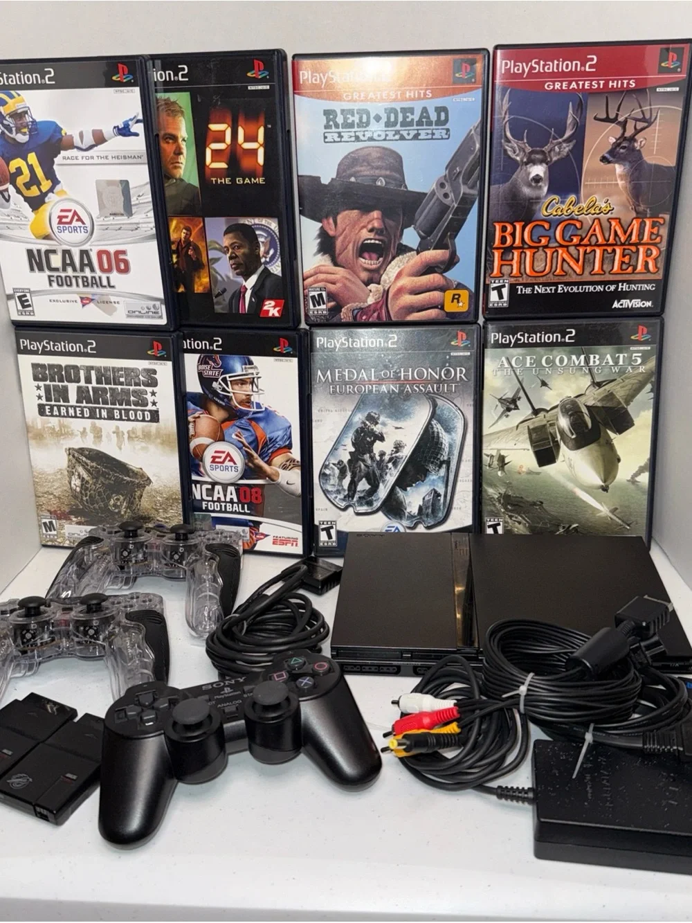 Sony PlayStation 2 Slim Console Bundle in Black with games and Controllers